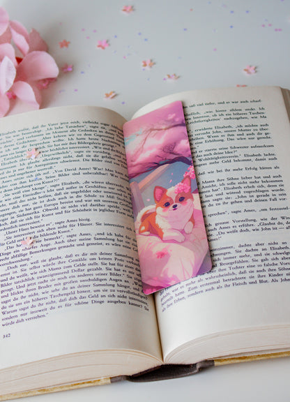 Kawaii Lesezeichen mit Corgi-Welpe, rosa Blumenkranz und pastellfarbenem Traumhintergrund