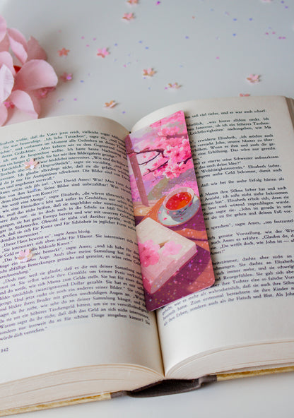 Kawaii Lesezeichen mit Matcha-Tee und Sakura-Blüten, lila Sternenhimmel und japanische Ästhetik