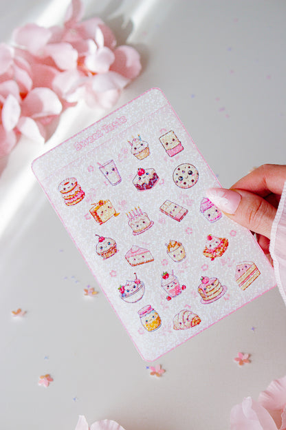 Kawaii Sticker Sheet Sweet Taste mit holografischen Punkten, 20 süße Motive wie Cupcakes, Torten und Donuts in Rosa, in der Hand gehalten