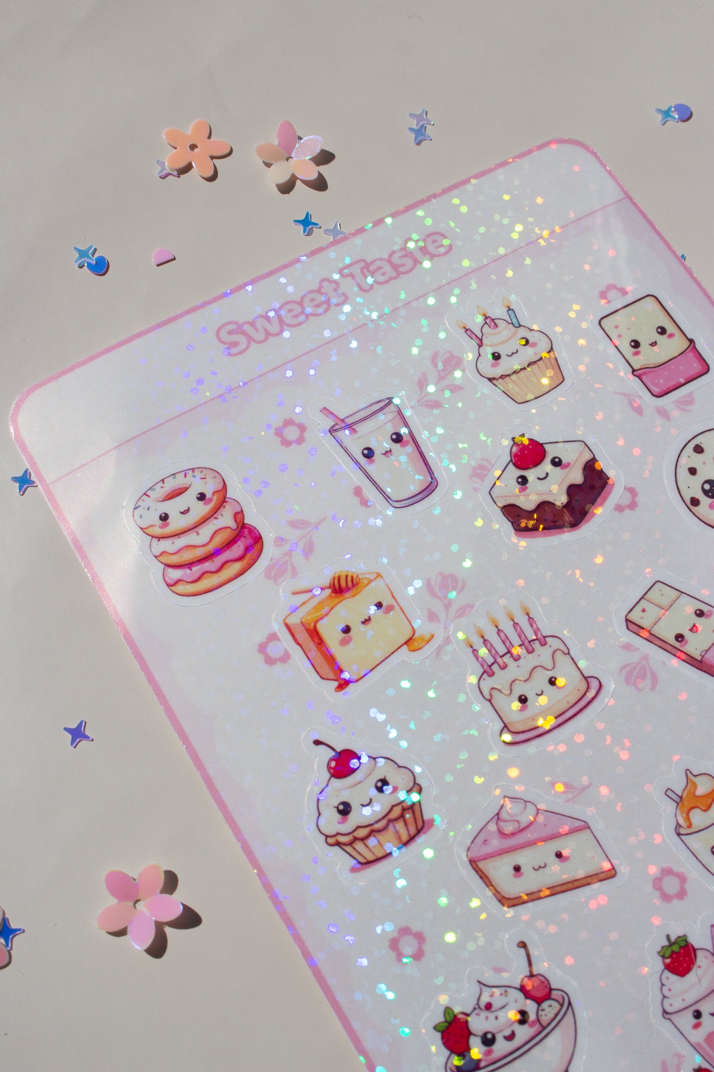 Sweet Taste Sticker Bogen Frontansicht – 20 kawaii Dessert-Sticker auf weißem Bogen mit rosa Rahmen, Motive: Donut, Milchglas, Cupcake, Brownie, Keks, Torte, Schokolade, Waffel, Croissant und mehr